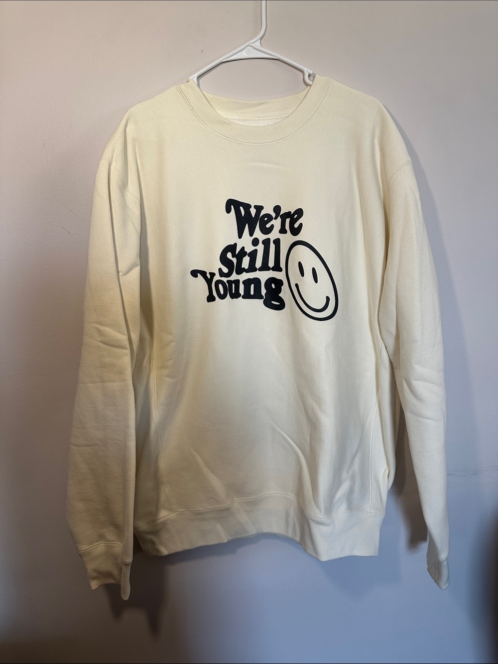 We’re Still Young Cream Graphic Crewneck Sweater
